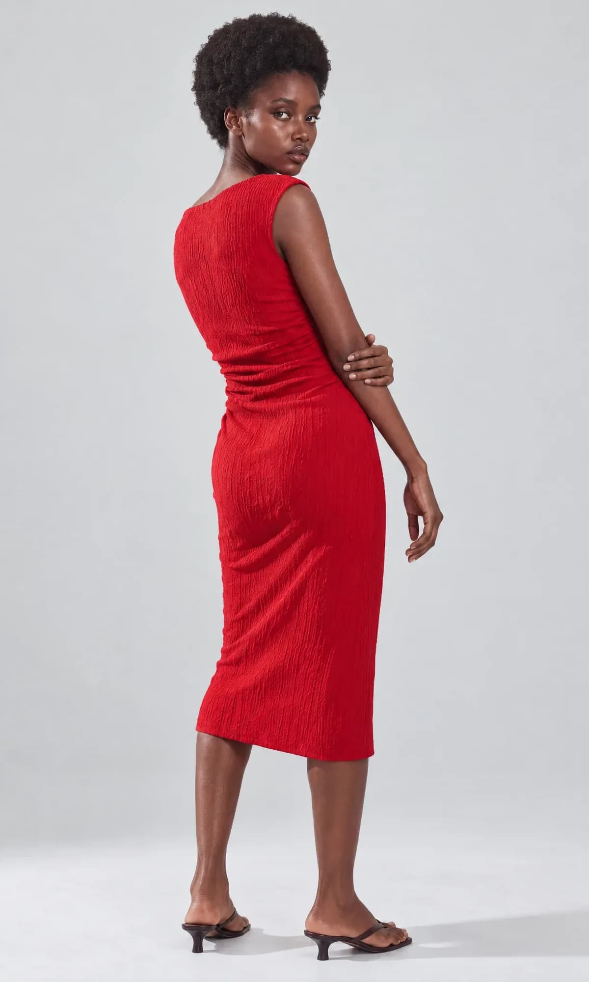 Back catalogue view of a model wearing a red dress