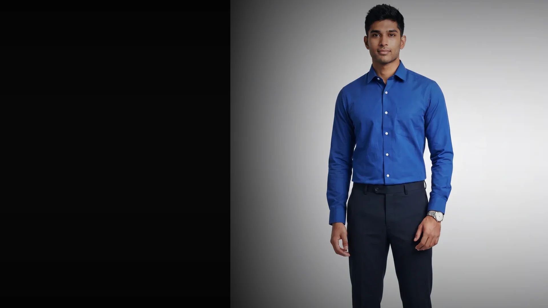 Fashion model in a red shirt beside a dark copy field.