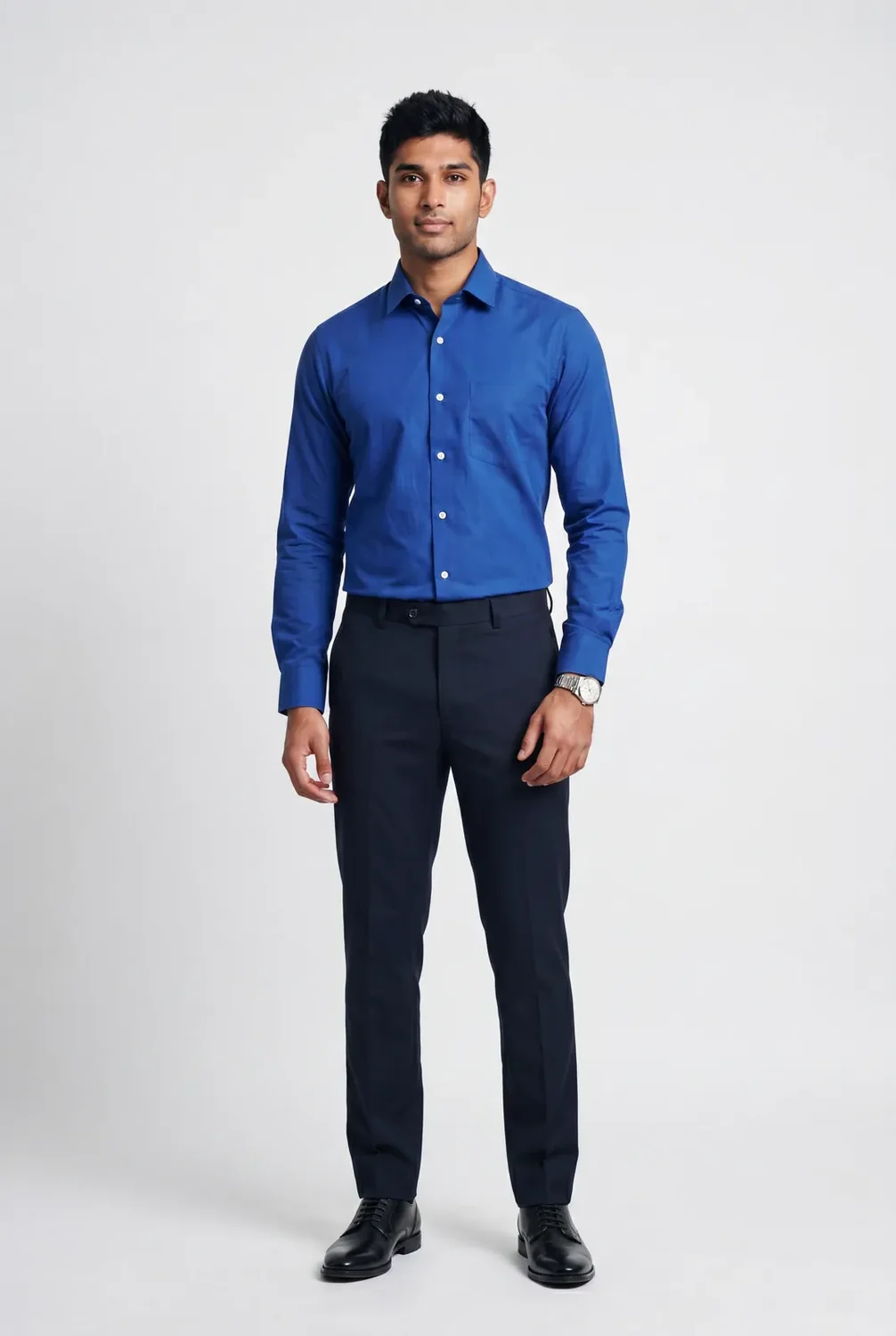 Male fashion model in a red shirt against a neutral studio background.